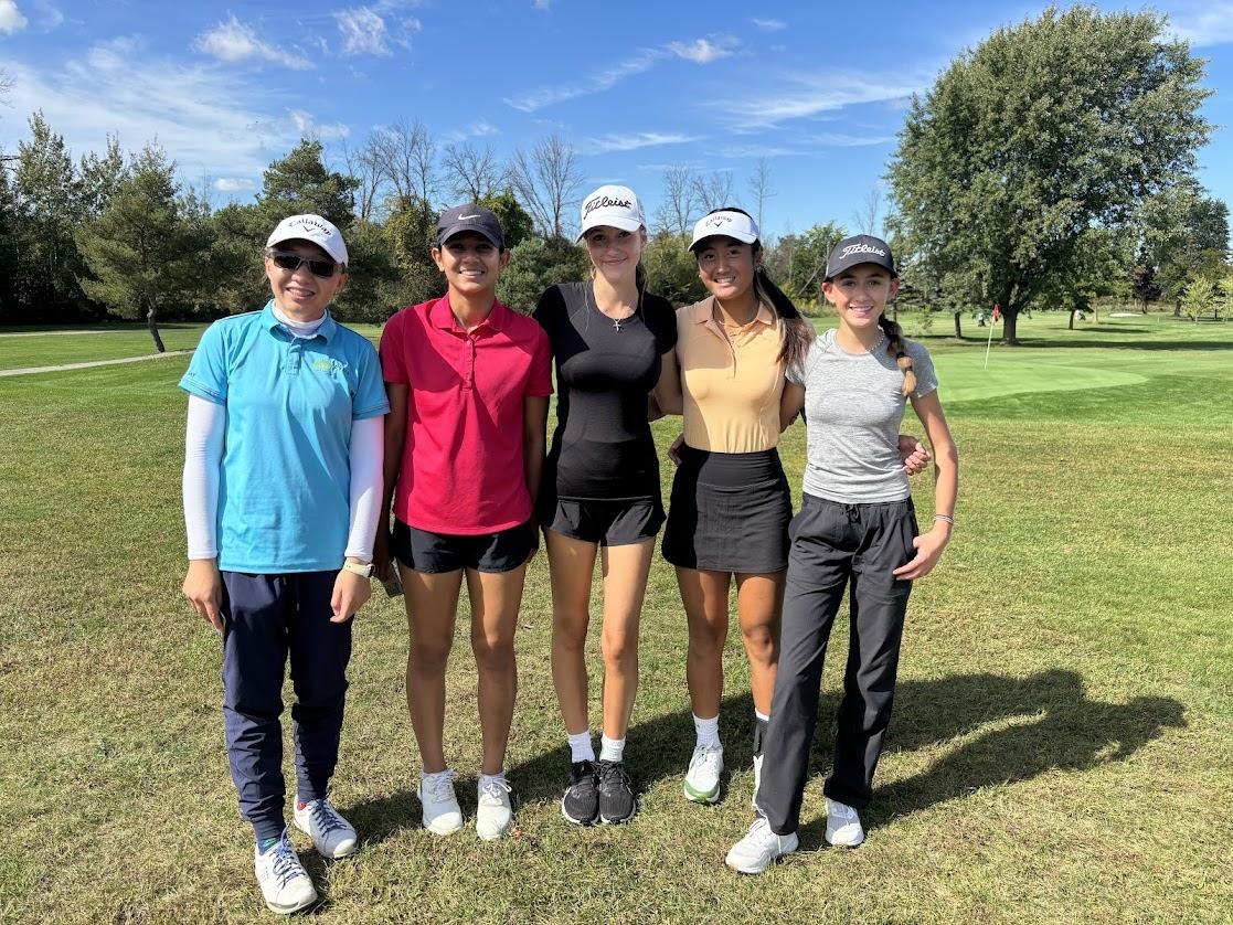 members of the golf team on the course