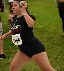 student throwing shotput
