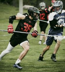 lacrosse players playing a game