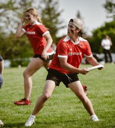 student throwing frisbee