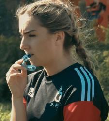 student standing on rugby field