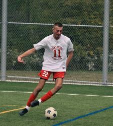 soccer player dribbling a ball