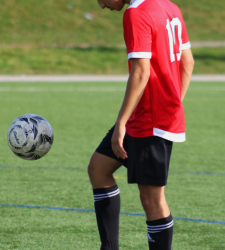 soccer player kicking a ball