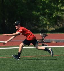 student catching frisbee