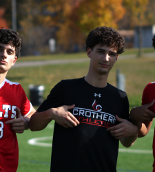 three soccer players
