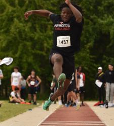 student running towards jump