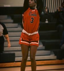 student making a shot in basketball