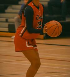 student preparing to take a shot basketball