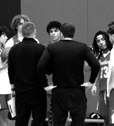 black and white coaches and basketball players