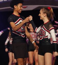students talking on cheer stage