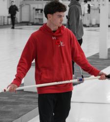 student holding broom