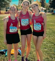 three students standing together