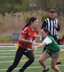 flag football player running with ball
