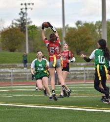 flag football player catching ball