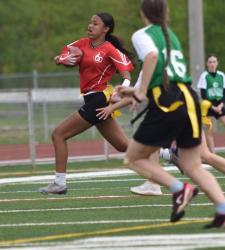 flag football player running with ball