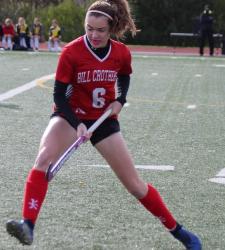 student playing field hockey