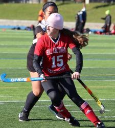student playing field hockey