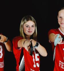 three members of field hockey team