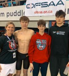 members of the swim team and coach