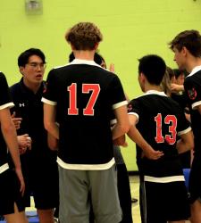 student volleyball team huddle