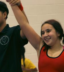 ref holding victorious student's arm up